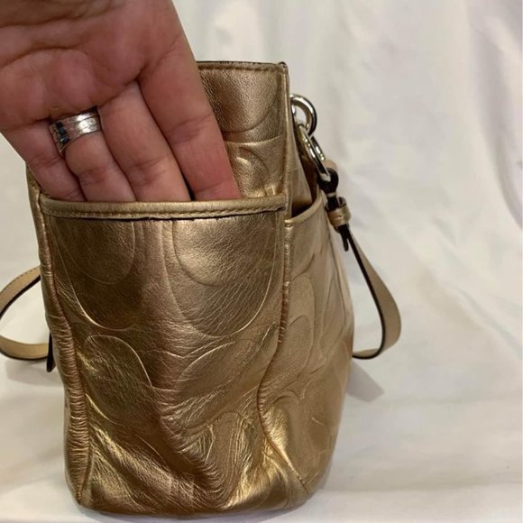 COACH gold handbag. Purple lining. Embedded coach logo. Big outside pock… - Picture 4 of 10